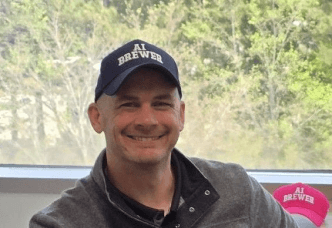 person wearing ai brewer cap
