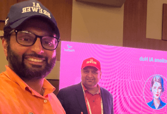 posing with ai brewer cap